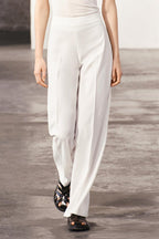 WHITE FLOWING TROUSERS WITH SIDE ZIP