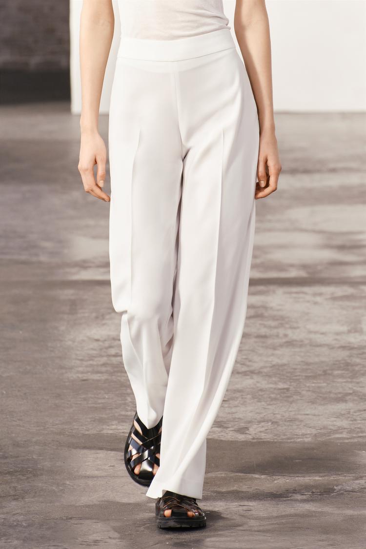 WHITE FLOWING TROUSERS WITH SIDE ZIP