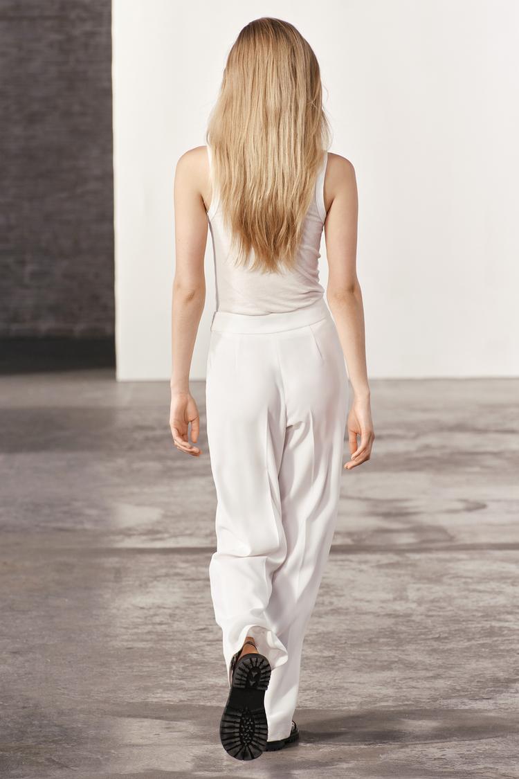 WHITE FLOWING TROUSERS WITH SIDE ZIP
